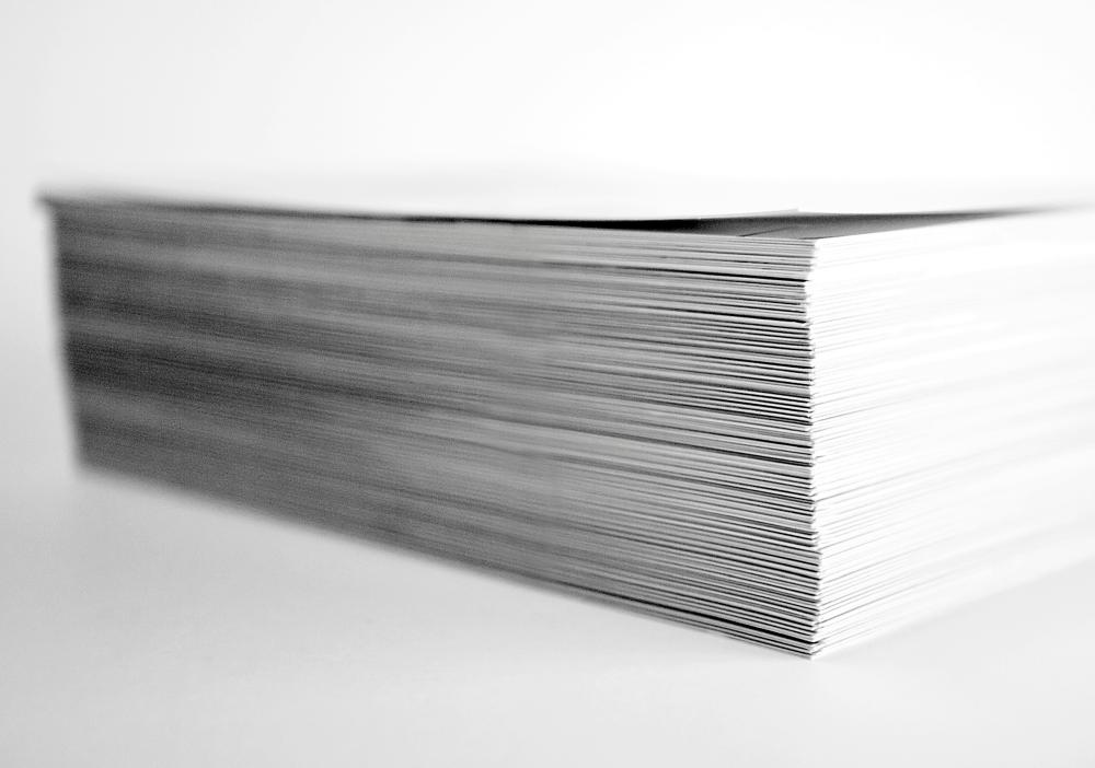A photo of a stack of print documents.